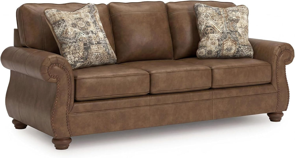 Signature Design by Ashley Shadsburne Rustic Faux Leather Sofa with Nailhead Trim and 2 Throw Pillows, Brown