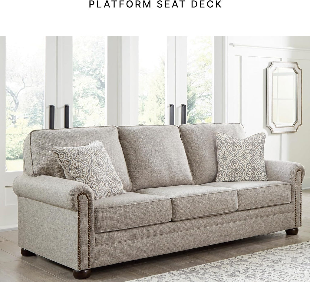 Signature Design by Ashley Gaelon Transitional Sofa with Nailheads and 2 Accent Pillows, Beige
